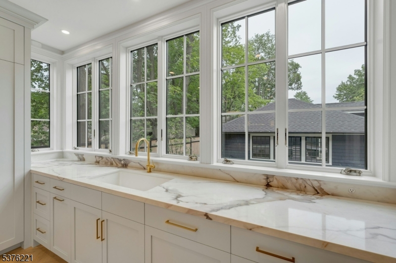 82 Watchung Avenue Montclair, NJ 07043 - Photo 16 of 48 a view of a granite countertop sink and a window
