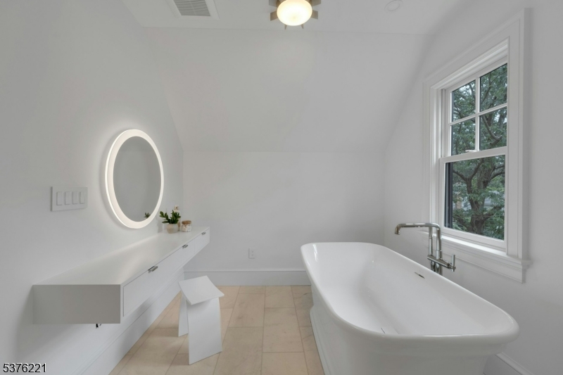 82 Watchung Avenue Montclair, NJ 07043 - Photo 37 of 48 a bathroom with a sink a toilet and a mirror