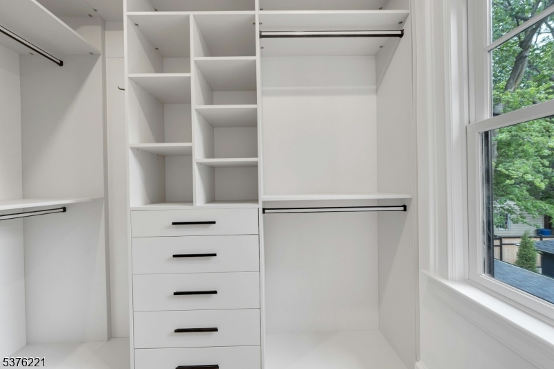 82 Watchung Avenue Montclair, NJ 07043 - Photo 40 of 48 a view of walk in closet with empty racks
