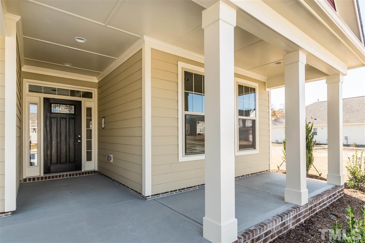 1505 Chestnut Falls Road Wendell, NC 27591 - Photo 2 of 25 Large Rocking chair front porch
