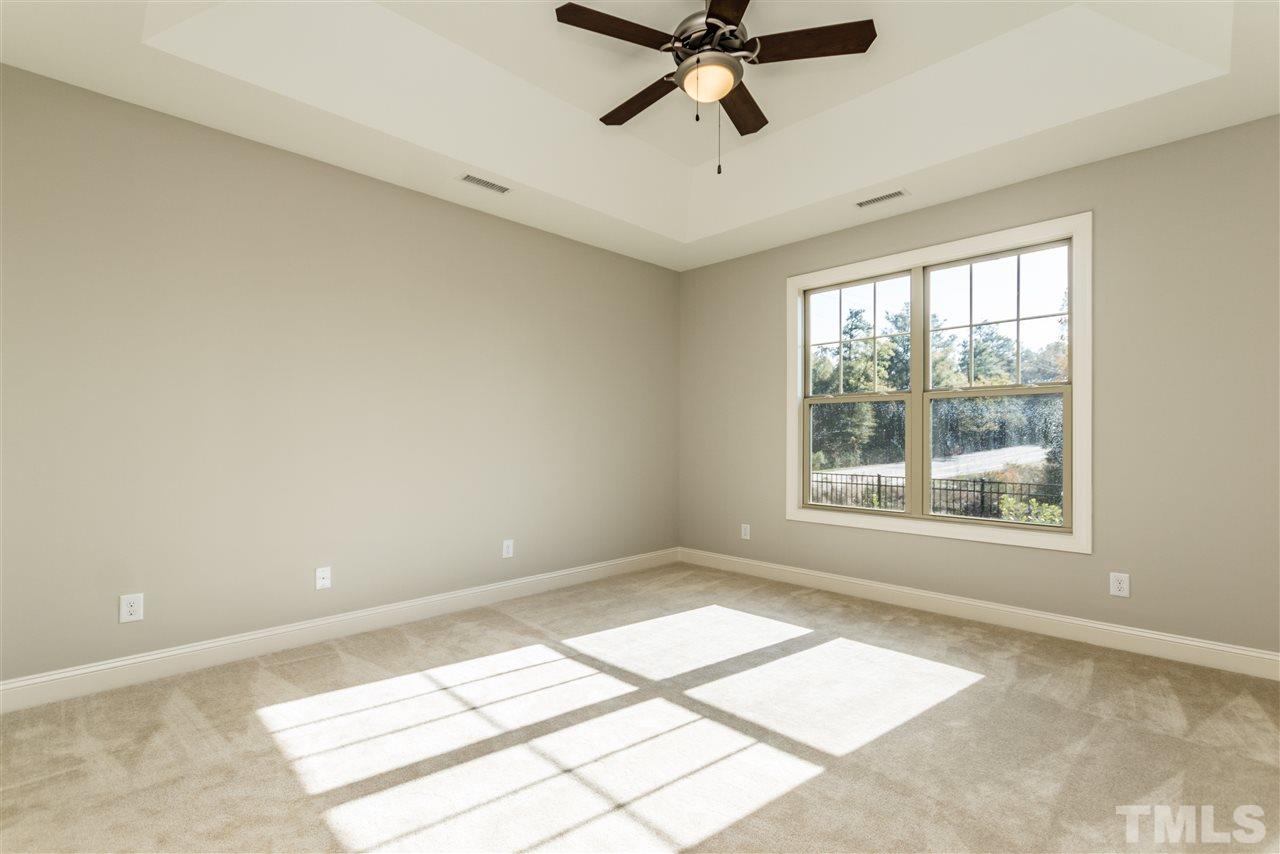 1505 Chestnut Falls Road Wendell, NC 27591 - Photo 13 of 25 1st Floor Owners bedroom is located in the back of the home for added privacy. Nice trey ceiling with ceiling fan included.