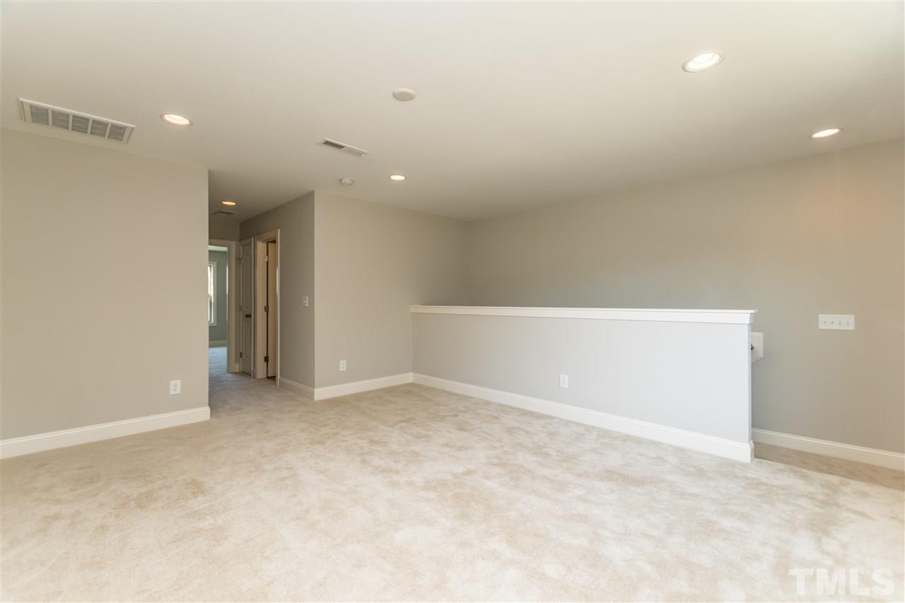 1505 Chestnut Falls Road Wendell, NC 27591 - Photo 19 of 25 Large loft on the second floor with recessed lighting and an adjoining 3rd full bath great for hobbies or Sunday Football.