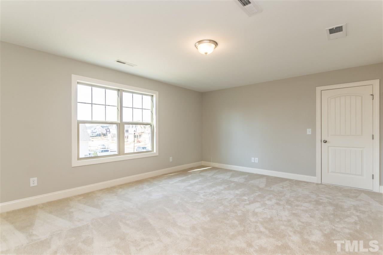 1505 Chestnut Falls Road Wendell, NC 27591 - Photo 22 of 25 Bedroom#3 is 14x18 and is located on the 2nd floor. Large walk-in storage room off the bedroom is 12x20 and provides plenty of space for your Christmas decorations, luggage, etc.