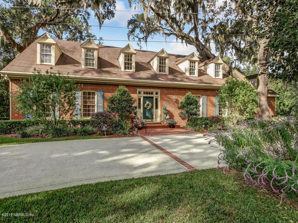 12200 Mandarin Road Jacksonville, FL 32223 - Photo 3 of 60 a front view of a house with garden