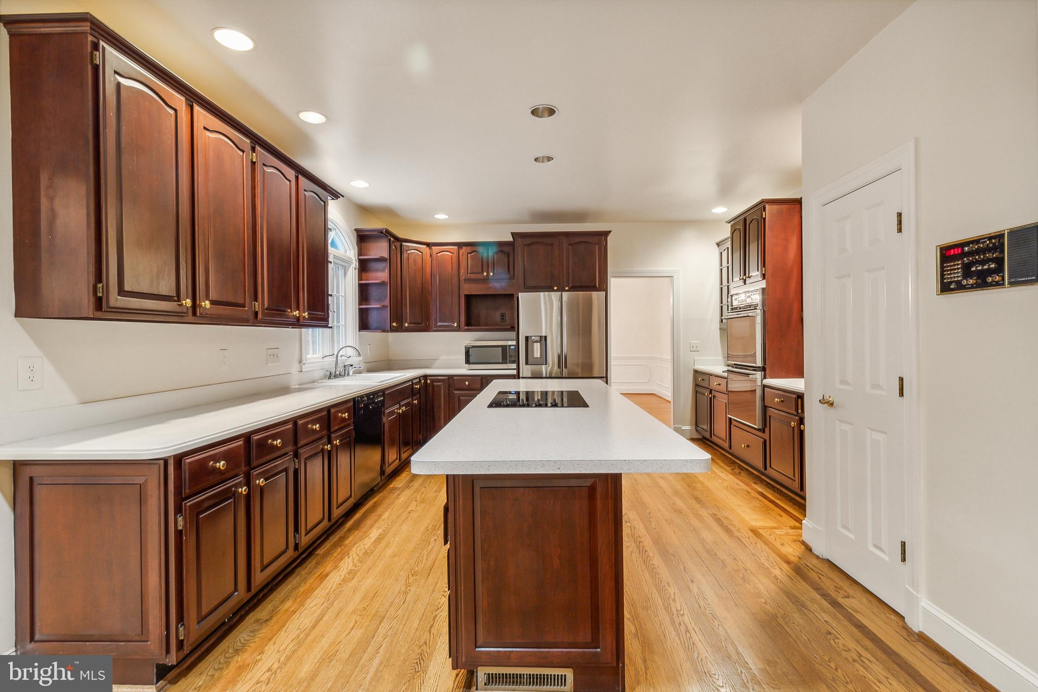 2527 Hunter Mill Road Oakton, VA 22124 - Photo 17 of 85 Elegant kitchen with rich cabinetry.