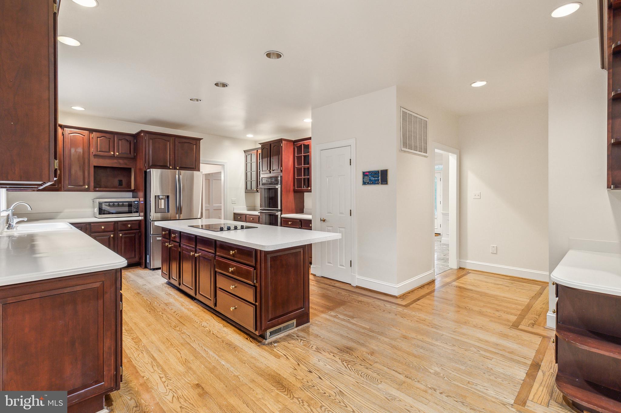 2527 Hunter Mill Road Oakton, VA 22124 - Photo 18 of 85 Spacious kitchen with rich wood accents.