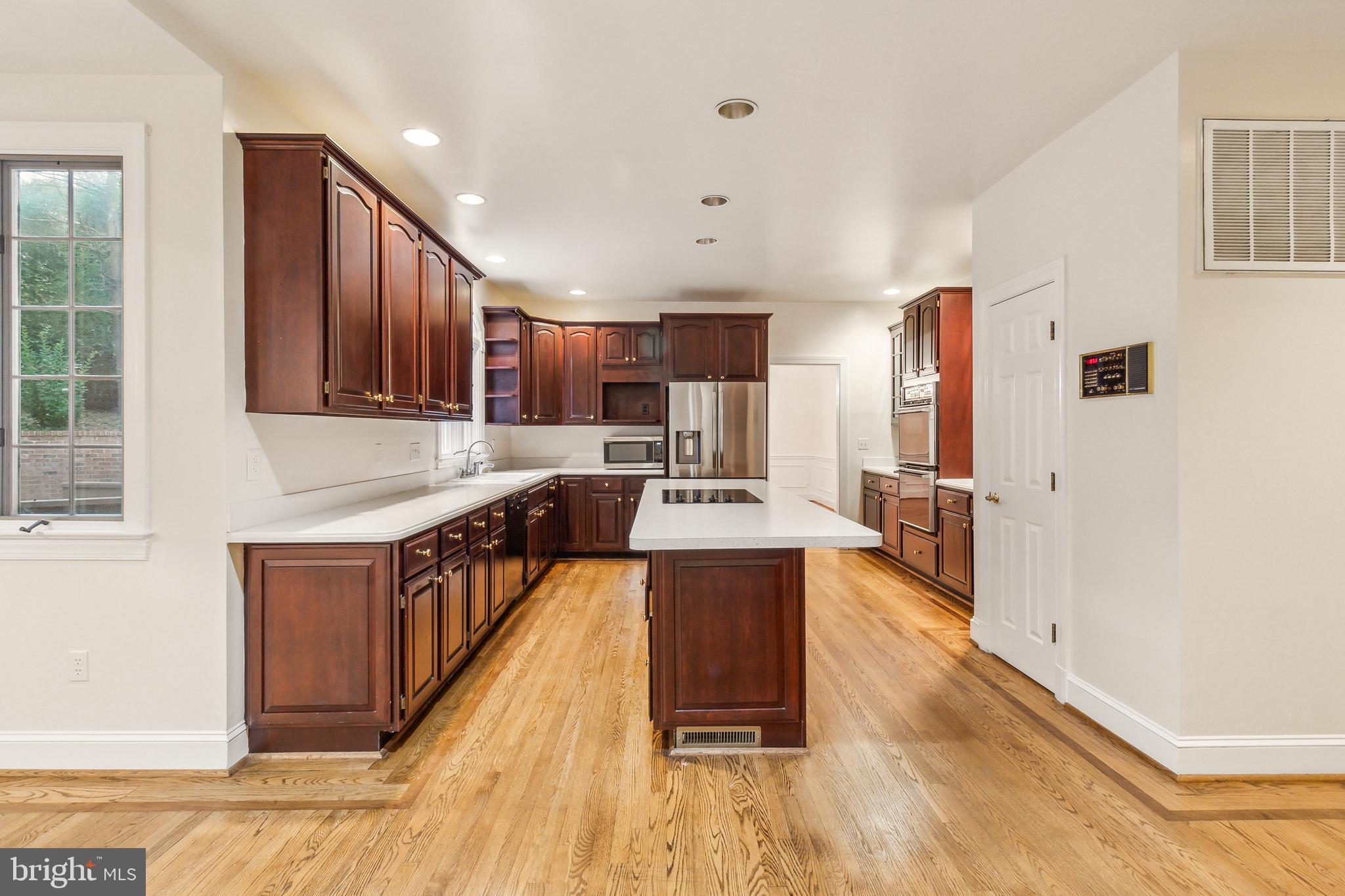 2527 Hunter Mill Road Oakton, VA 22124 - Photo 19 of 85 Elegant kitchen with rich cabinetry.
