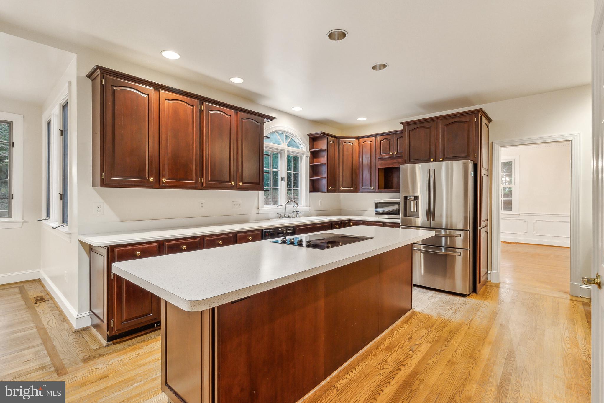 2527 Hunter Mill Road Oakton, VA 22124 - Photo 20 of 85 Elegant kitchen with rich cabinetry.