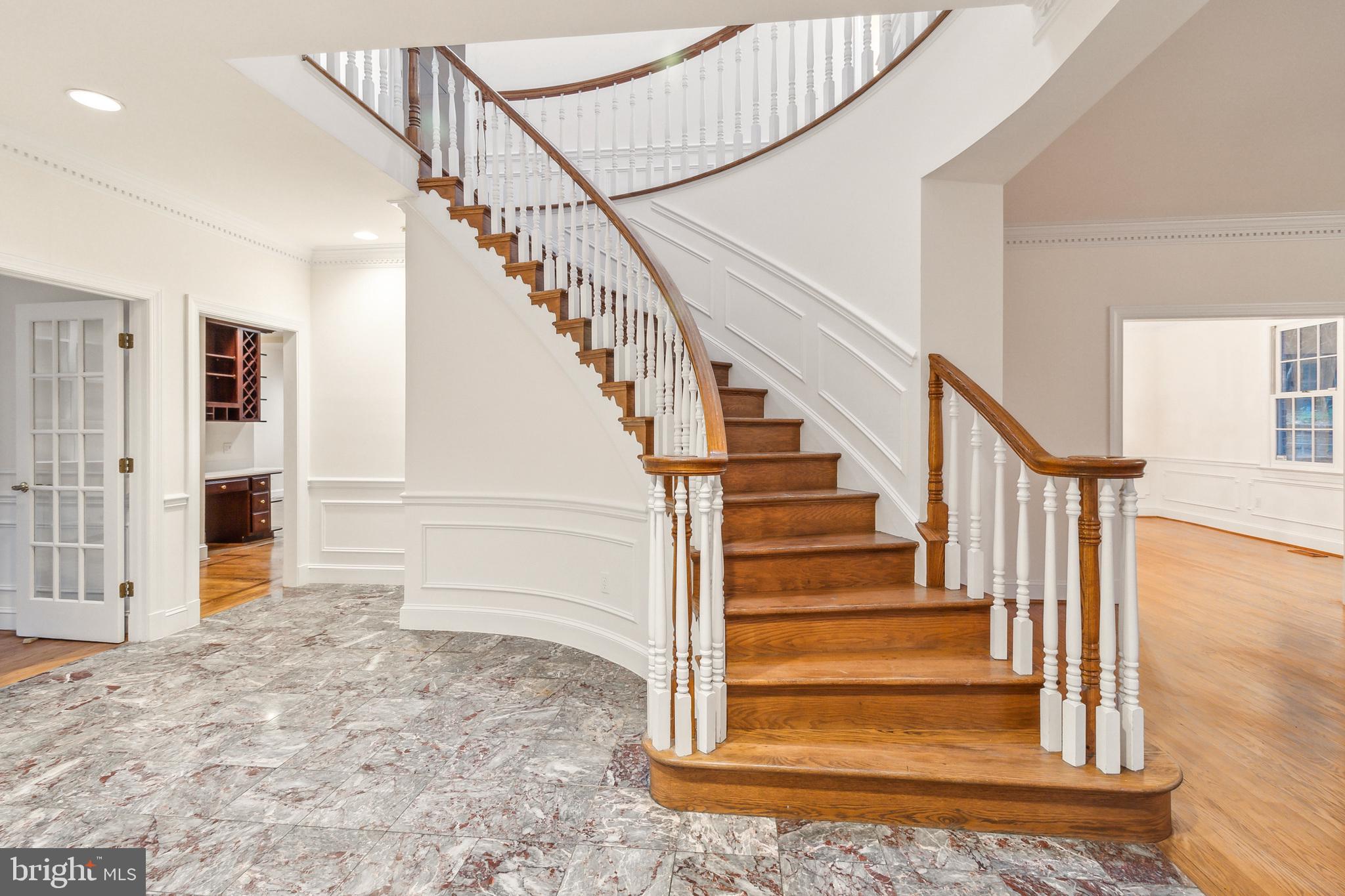 2527 Hunter Mill Road Oakton, VA 22124 - Photo 35 of 85 Elegant staircase in a grand foyer.