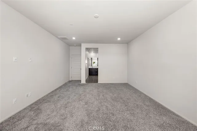 a spacious bathroom with a shower sink and mirror