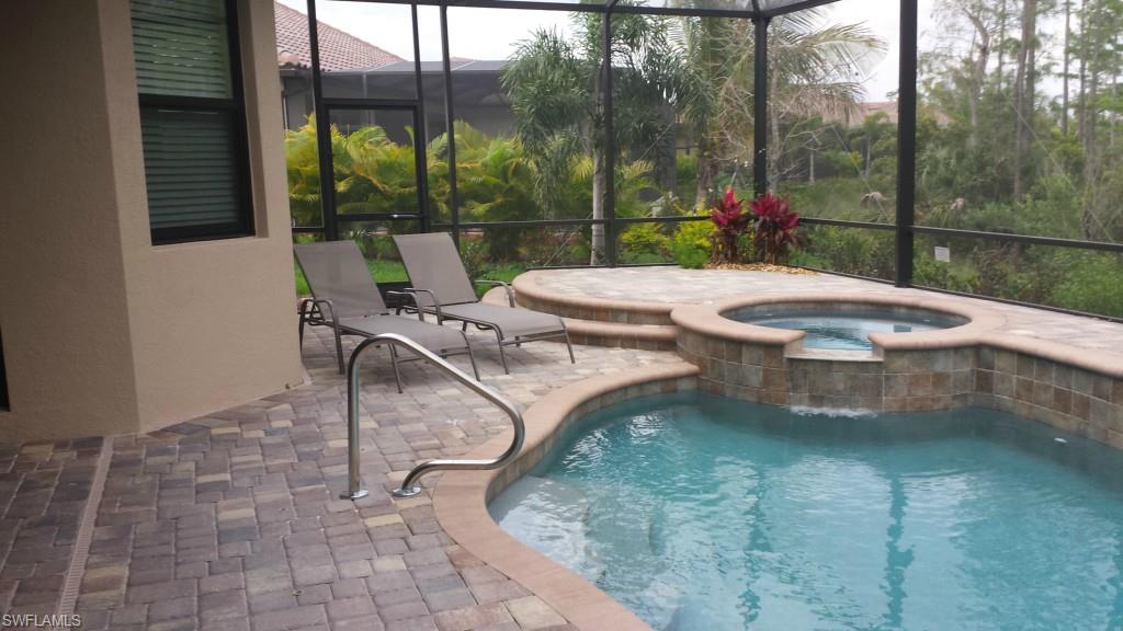 9560 Firenze Circle Naples, FL 34113 - Photo 14 of 19 a view of a patio with a table chairs and a patio