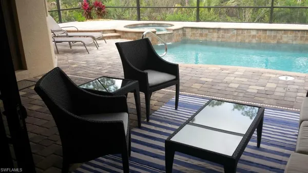 a view of a chairs and table on the deck
