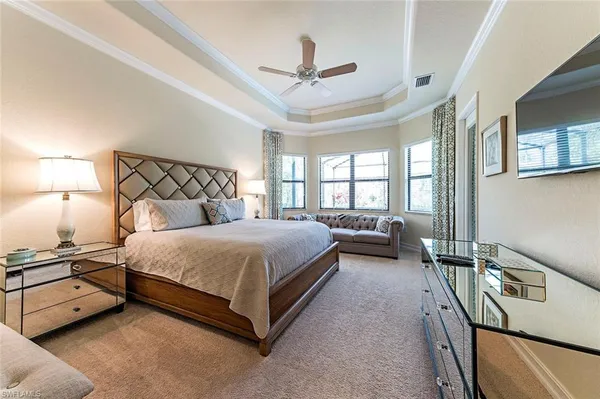 a bedroom with a bed and a night stand