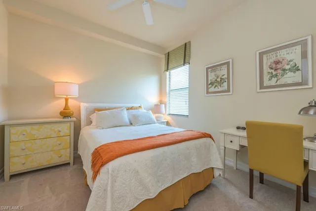 a bedroom with a bed and a chair