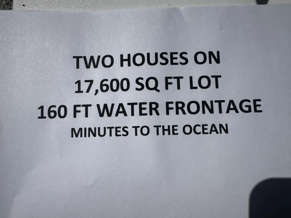 a view of a swimming pool with outdoor seating