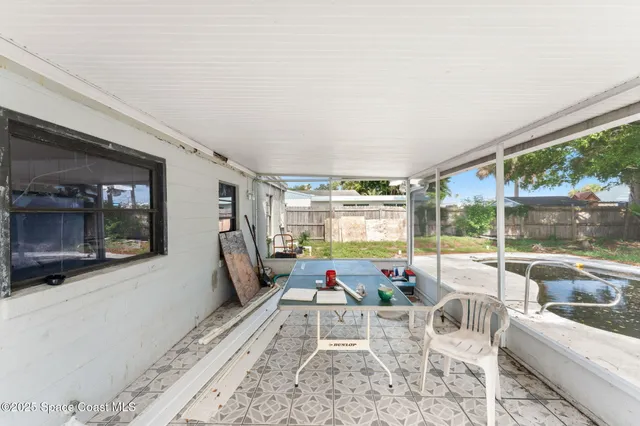 a view of a swimming pool with a patio