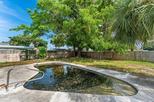 a view of a swimming pool with a patio