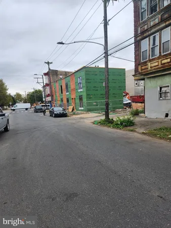 a view of a street with cars