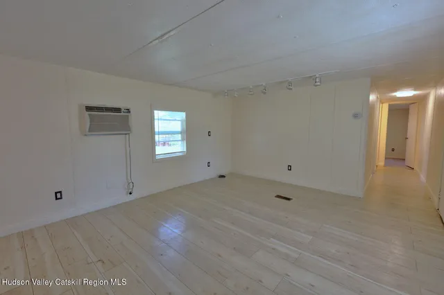 a kitchen with stainless steel appliances a stove a microwave and a refrigerator