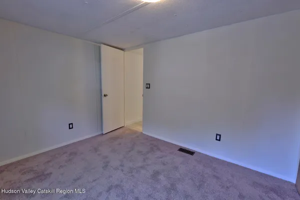 a view of a balcony with wooden floor