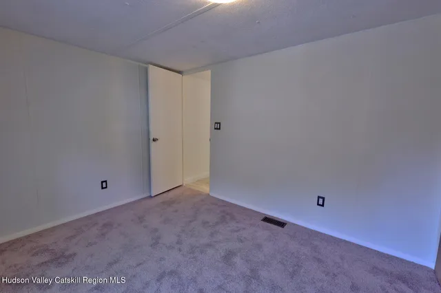 a view of a balcony with wooden floor