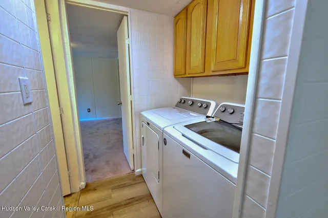 a view of a balcony with wooden floor and fence