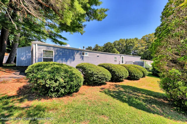 a view of a garden with a house