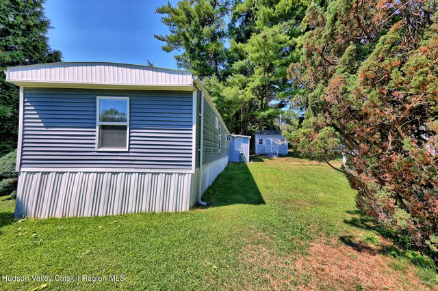 a view of a swimming pool with sitting area
