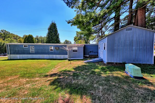 a view of a city with lush green forest