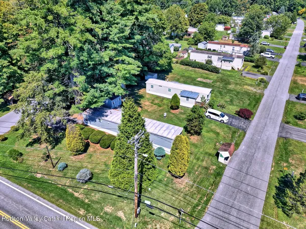 an aerial view of residential houses with outdoor space