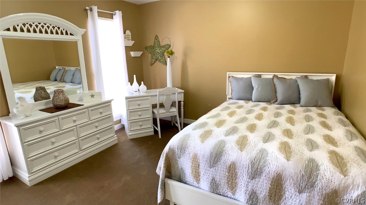 3402 Walkers Ferry Road Midlothian, VA 23112 - Photo 30 of 44 a bedroom with a bed and a mirror on dresser