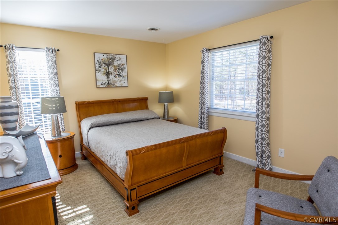 3402 Walkers Ferry Road Midlothian, VA 23112 - Photo 31 of 44 a bedroom with a bed and wooden floor