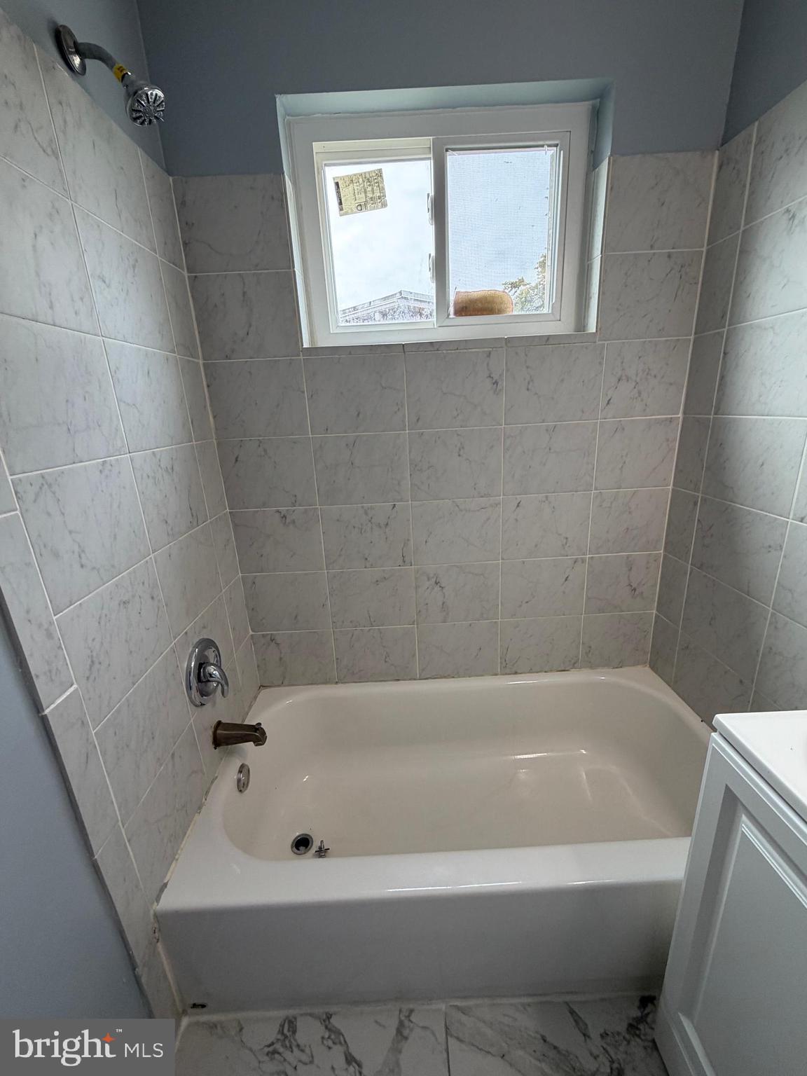 924 7th Street Laurel, MD 20707 - Photo 13 of 21 a bathroom with a bathtub