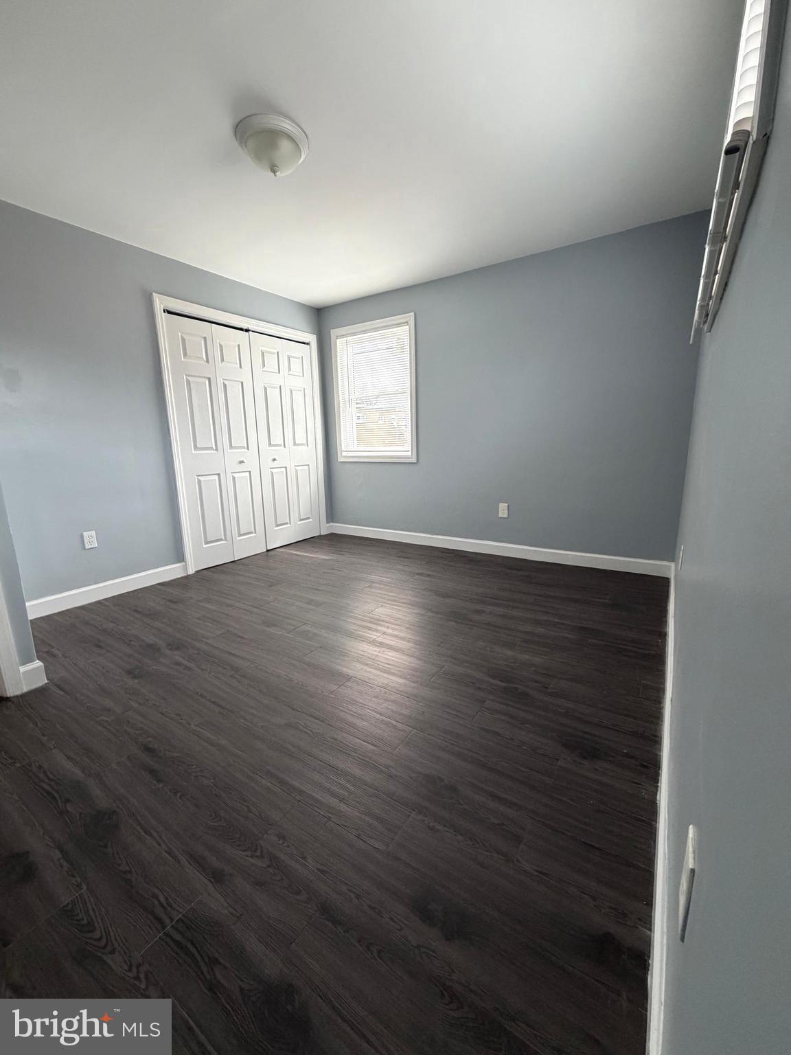 924 7th Street Laurel, MD 20707 - Photo 14 of 21 wooden floor in an empty room with a window