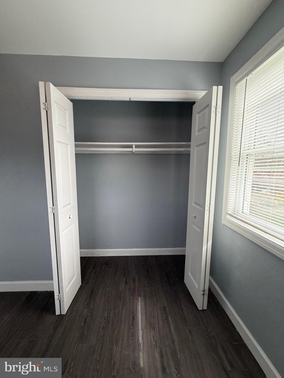 924 7th Street Laurel, MD 20707 - Photo 15 of 21 a view of empty room with wooden floor and window