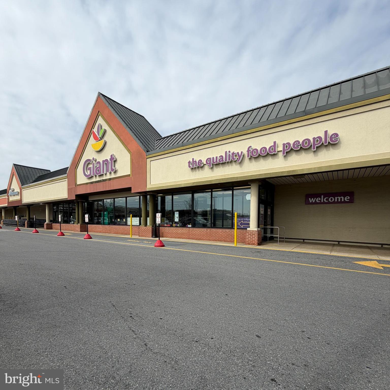 924 7th Street Laurel, MD 20707 - Photo 21 of 21 a view of a building with retail shops and traffic signal