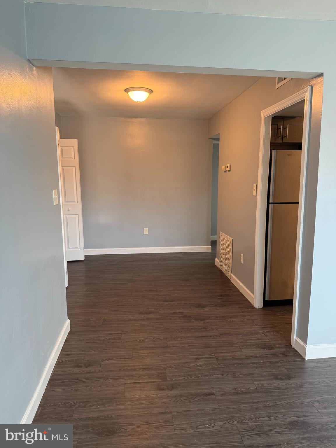 924 7th Street Laurel, MD 20707 - Photo 6 of 21 a view of empty room with wooden floor