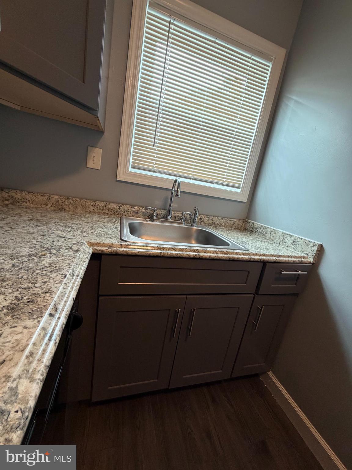 924 7th Street Laurel, MD 20707 - Photo 9 of 21 a bathroom with a granite countertop sink and a mirror