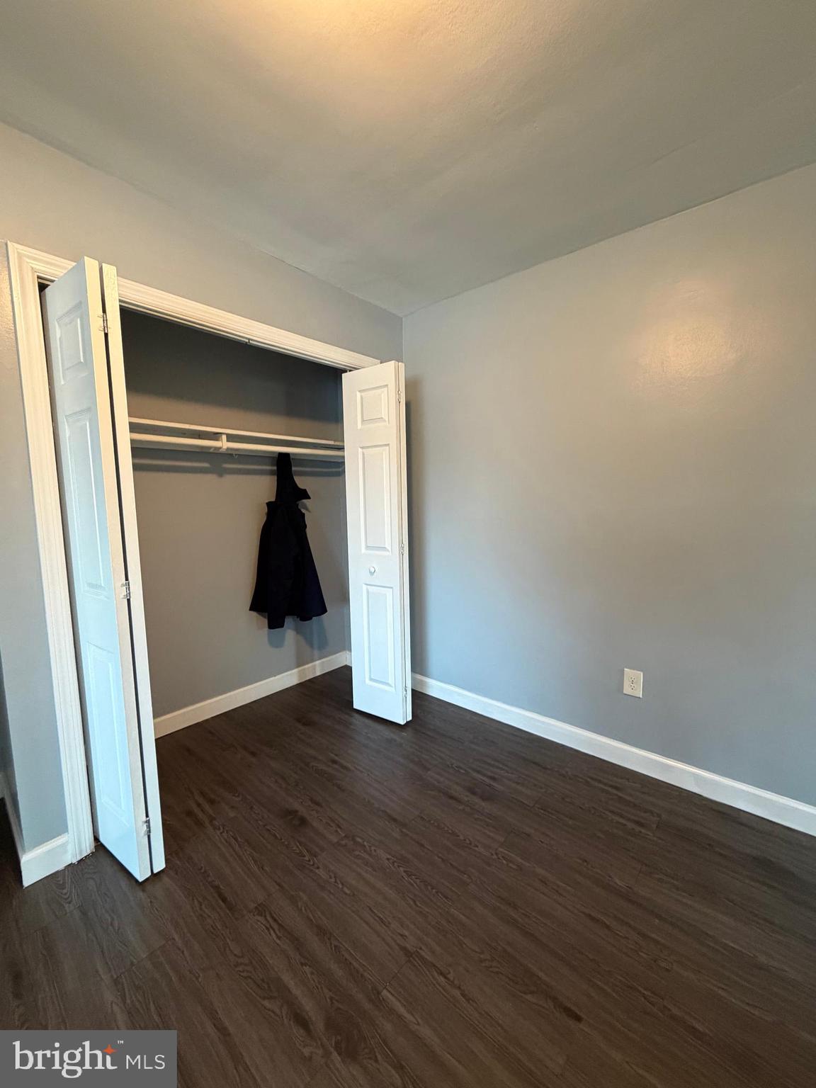 924 7th Street Laurel, MD 20707 - Photo 10 of 21 a view of an empty room with wooden floor and closet