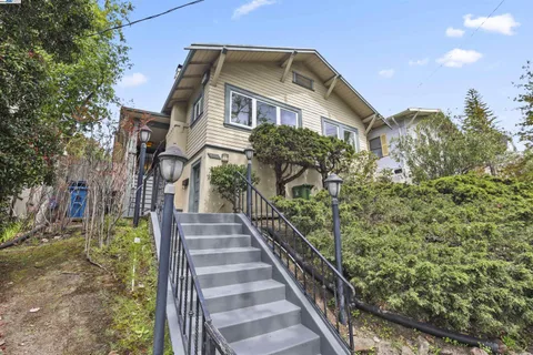 a view of a house with wooden fence