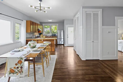a kitchen with stainless steel appliances granite countertop a sink and a wooden cabinets