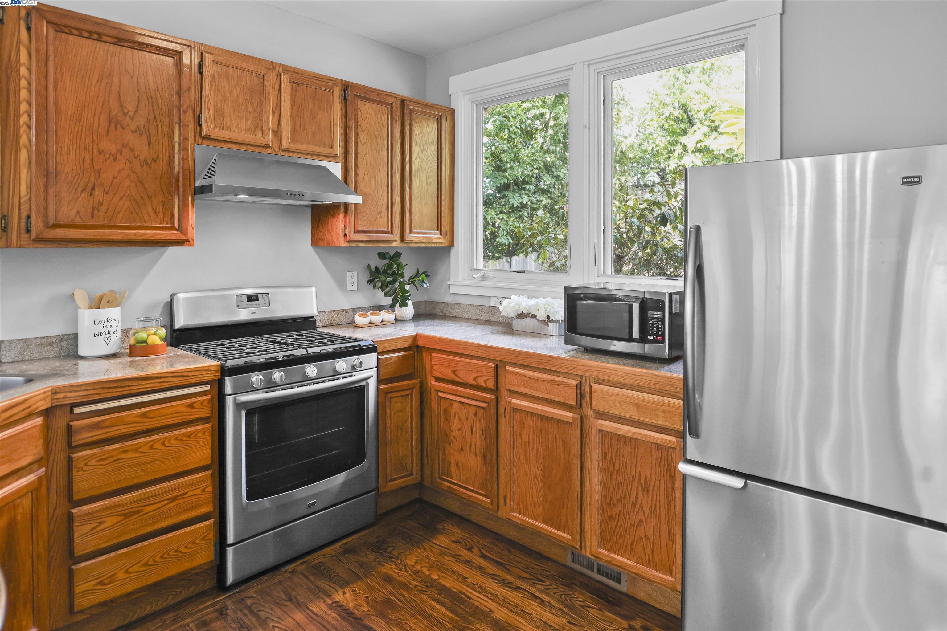 1361 Oakland Avenue Piedmont, CA 94611 - Photo 17 of 27 a kitchen with stainless steel appliances granite countertop a stove a sink and a refrigerator