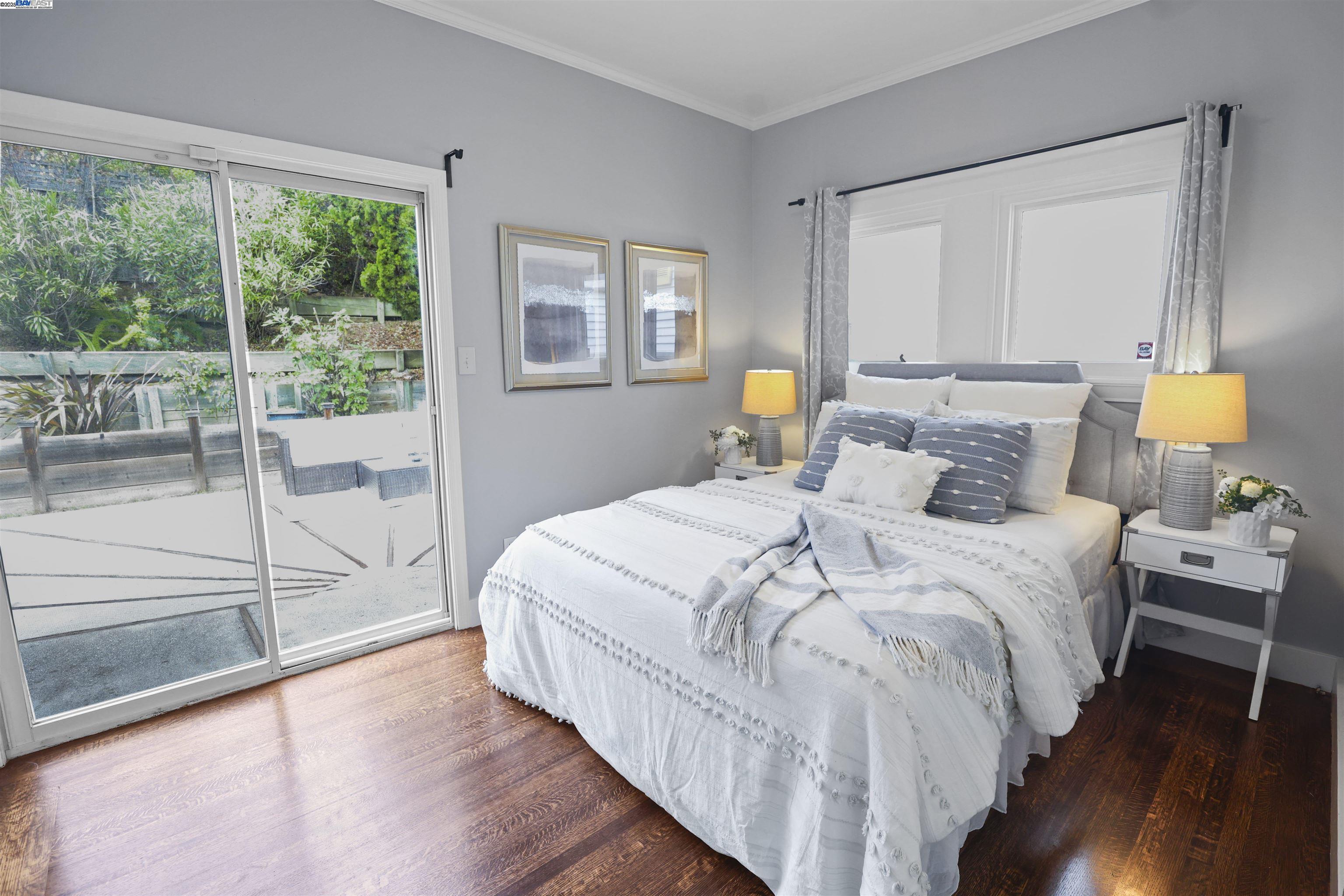 1361 Oakland Avenue Piedmont, CA 94611 - Photo 21 of 27 a bed sitting in a bedroom next to a window