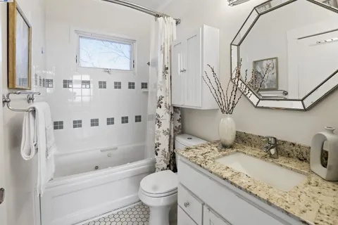 a view of a terrace with chairs and potted plants
