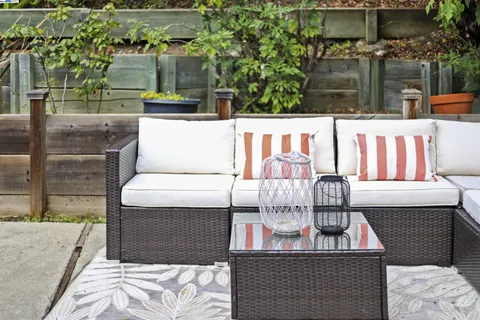 a outdoor living space with furniture and flowers