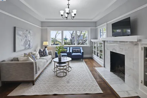 a vase of flowers sitting on a table with chairs