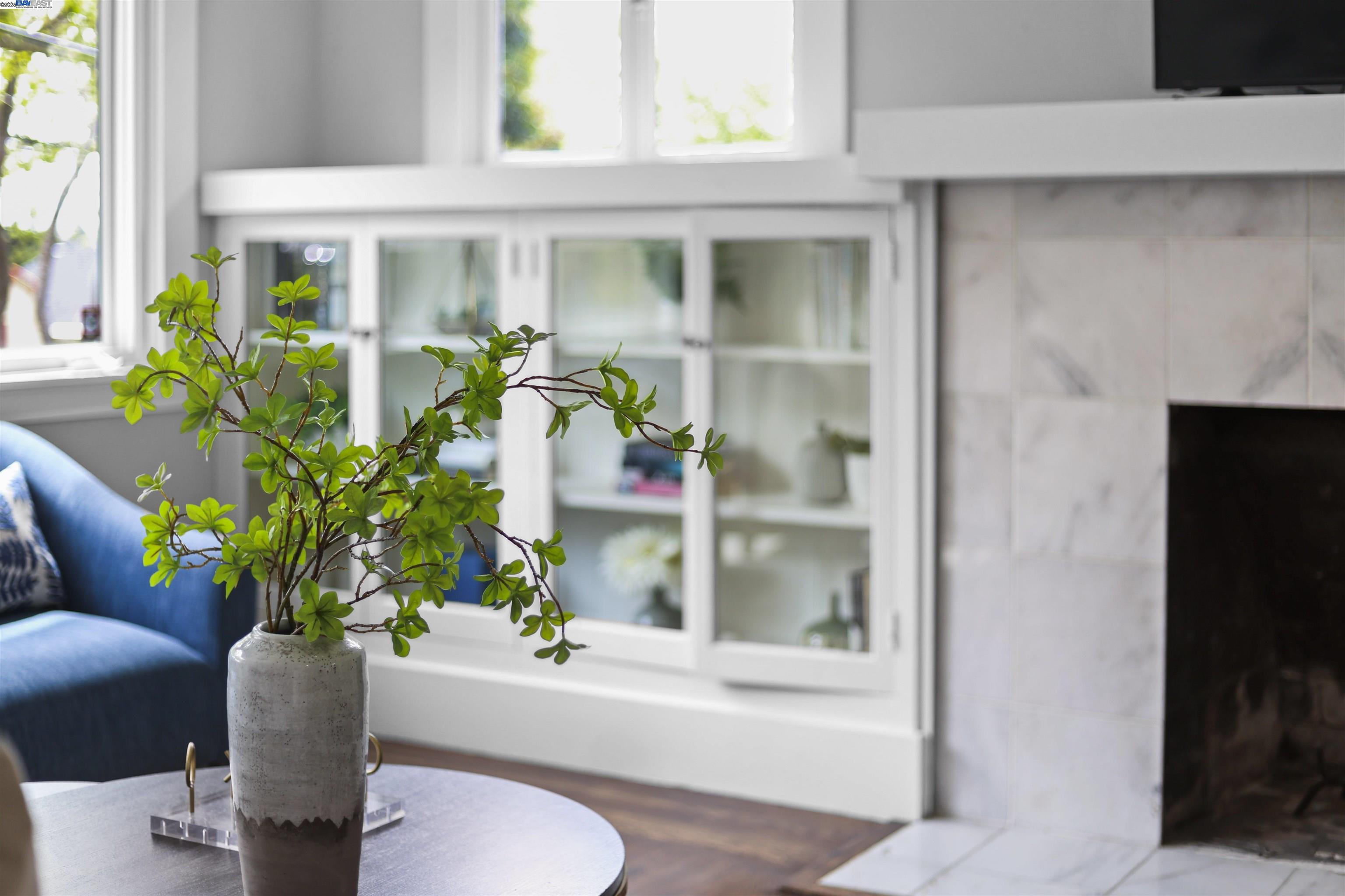 1361 Oakland Avenue Piedmont, CA 94611 - Photo 6 of 27 a white vase with flowers sitting on a table