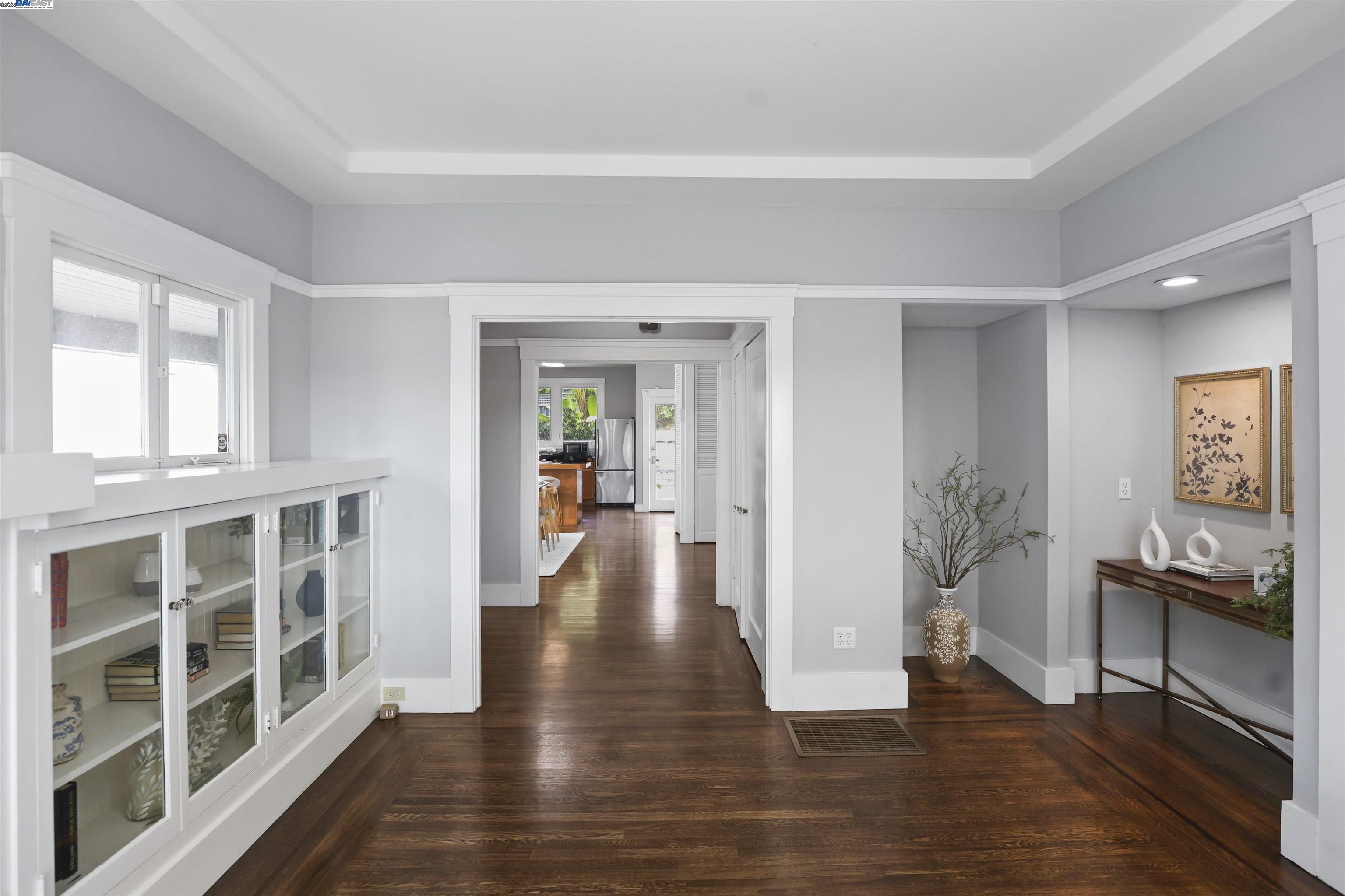 1361 Oakland Avenue Piedmont, CA 94611 - Photo 8 of 27 a view of a big room with wooden floor and windows