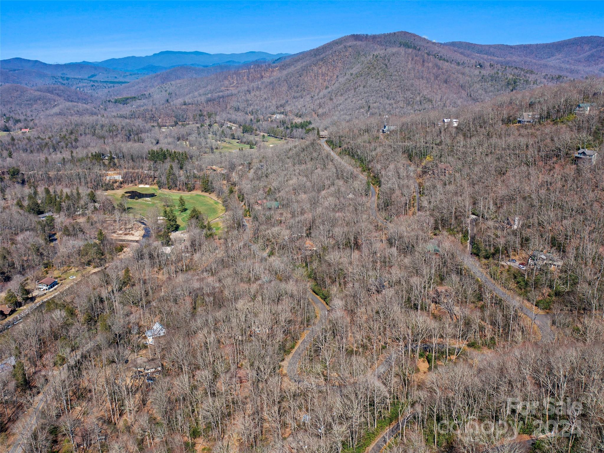0 Big Ridge Road, Unit 62 & 63 Burnsville, NC 28714 - Photo 12 of 31 a view of a lush green hillside and a building