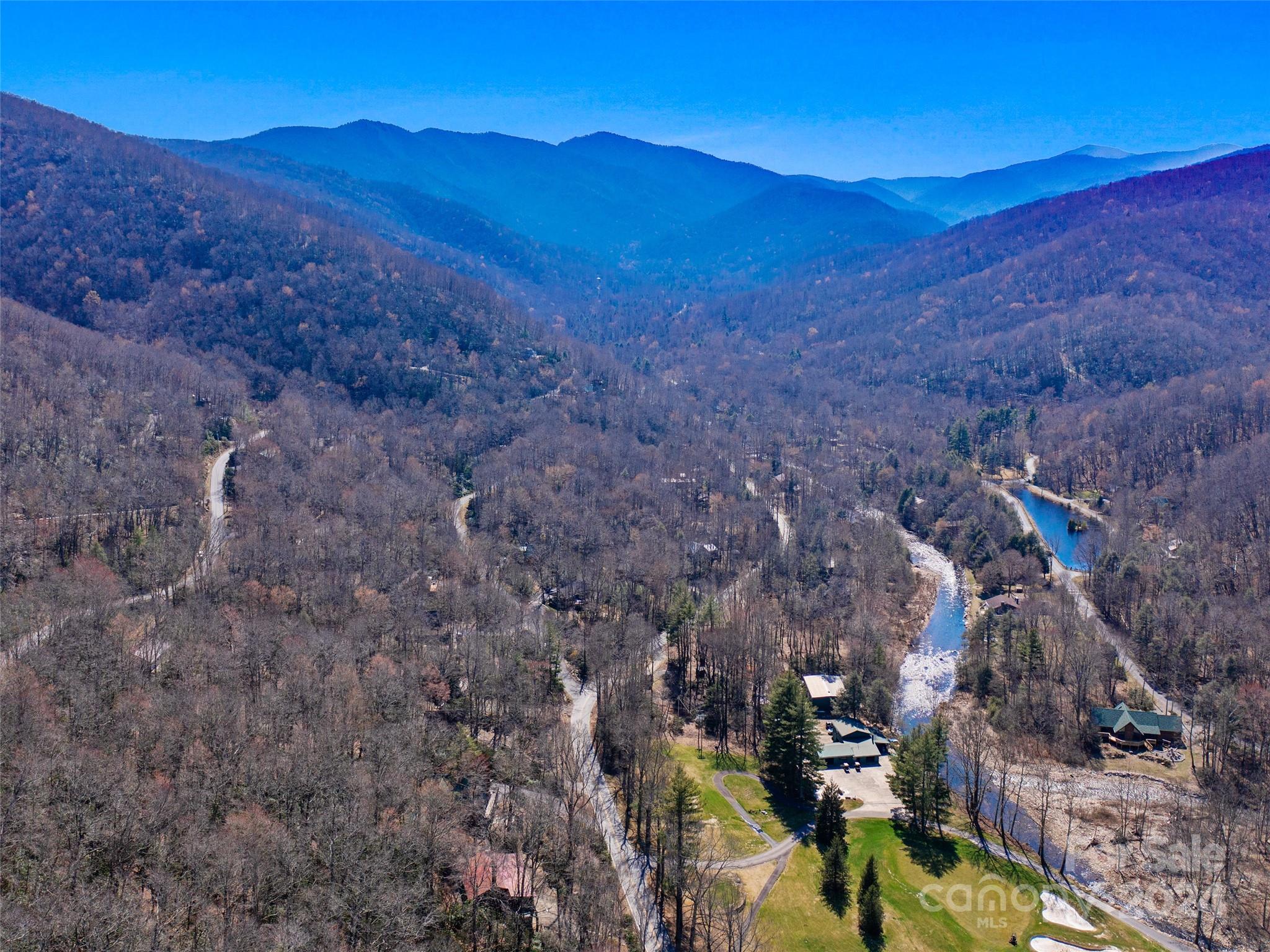 0 Big Ridge Road, Unit 62 & 63 Burnsville, NC 28714 - Photo 15 of 31 a view of a lush green hillside and a houses